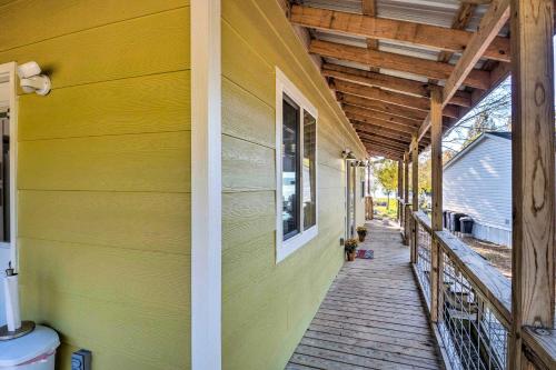 a porch of a house with a yellow wall at Lovely Toledo Bend Studio with Scenic Views! in Many