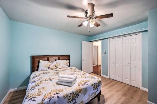 a bedroom with a bed and a ceiling fan at Cozy Redmond Retreat Spacious Deck and Yard! in Redmond