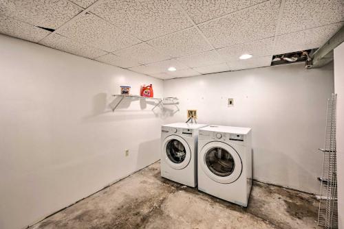 a laundry room with a washing machine in it at Cozy Redmond Retreat Spacious Deck and Yard! in Redmond