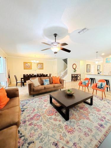 a living room with a couch and a table at DWS Vacation Villas in Orlando