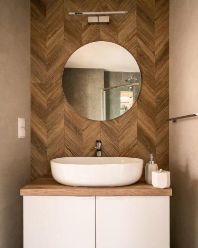 a bathroom with a sink and a mirror at Wy_spa_Podolany in Gdów