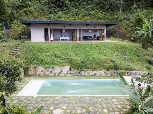a house with a swimming pool in front of it at TERRAMAGA glamping in San Francisco