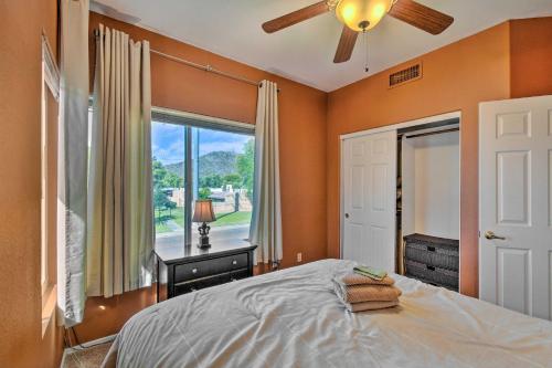 a bedroom with orange walls and a bed and a window at Resort-Style Gem with Pool Access 10 Mi to Dtwn PHX in Phoenix