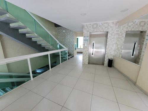 a hallway with a staircase in a building at Angra Inn, Angra dos Reis - Mar, Sol e Piscina in Angra dos Reis
