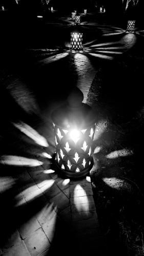 a vase with a light in the middle of a street at Villa Serena Marrakech - Maison d'hôtes in Marrakech