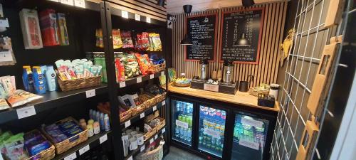 a grocery store aisle with food items on display at Toftegården Guesthouse - Rooms in Skagen