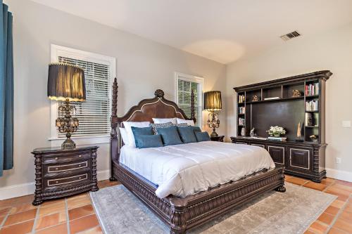a bedroom with a large bed with blue pillows at Grandview Gardens in West Palm Beach
