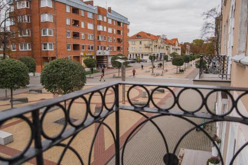 a view of a city street from a balcony at Naujas butas-studio Mažvydo al. in Klaipėda