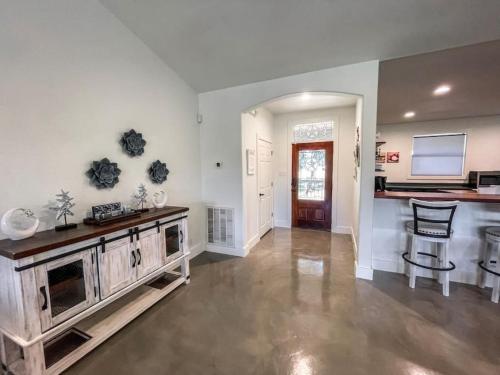 a large living room with a table and a counter at Lakeside Escape in McQueeney