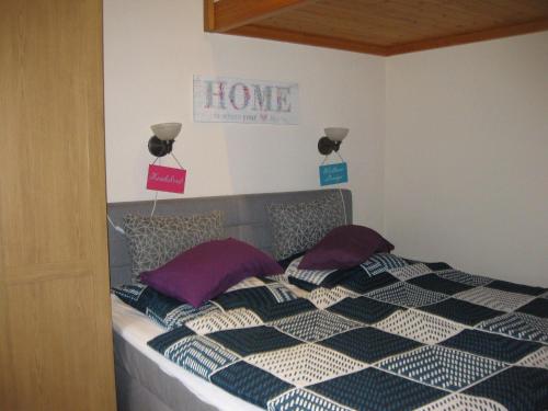 a bedroom with a bed with signs on the wall at Holiday Home in Germany with Scenic Nature in Berneburg
