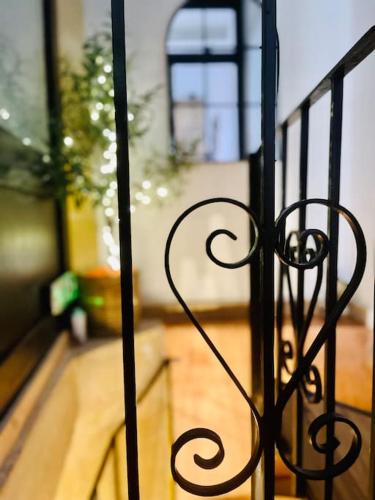 a black iron fence in a room with a porch at 300yr old, self catering, tiny house in Victoria Centre, Gozo in Victoria