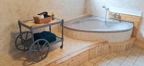 a bath tub in a bathroom with a sink at Blue Lagoon in Nehren