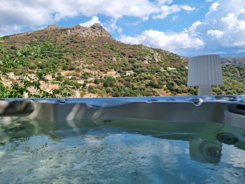 a bath tub with a view of a mountain at The Cosy Home Corbara by 1722 in Corbara