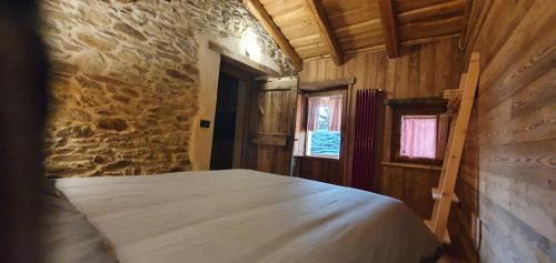 Postel nebo postele na pokoji v ubytování Casa Vacanza I Foresti Ex Scuola