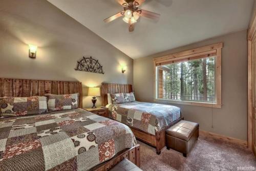 a bedroom with two beds and a window at Skier's Dream! Mansion Right Next to Heavenly in South Lake Tahoe