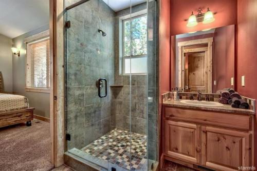 a bathroom with a shower and a sink at Skier's Dream! Mansion Right Next to Heavenly in South Lake Tahoe
