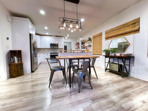 a kitchen and dining room with a table and chairs at King Bed-Private Yard-Driveway Parking in Sacramento