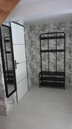 a room with a mirror and a black bunk bed at Maison rénovée dans le bocage Normand avec jacuzzi in Canisy