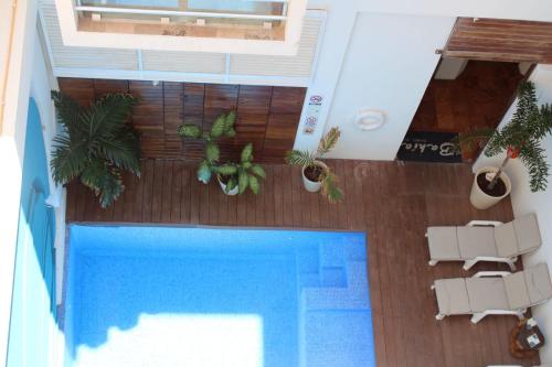 an overhead view of a swimming pool in a house at Bahia Chac Chi - Adults Only in Isla Mujeres