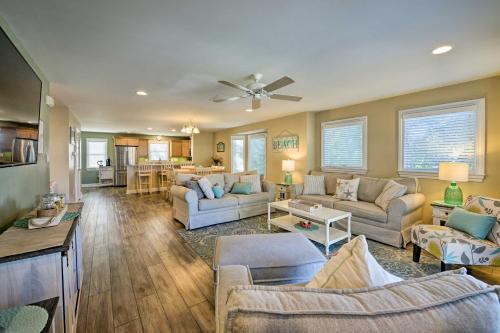 a large living room with couches and a table at Wildwood Townhome with Patio 1 Block To The Beach! in Wildwood