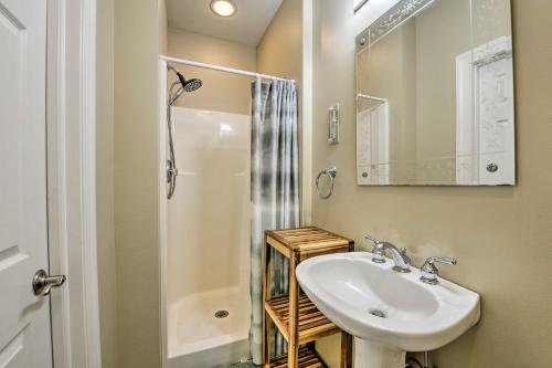 a white bathroom with a sink and a shower at Wildwood Townhome with Patio 1 Block To The Beach! in Wildwood