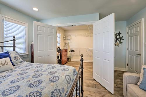a bedroom with a bed and a couch and a bathroom at Wildwood Townhome with Patio 1 Block To The Beach! in Wildwood