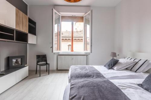 Posteľ alebo postele v izbe v ubytovaní Incantevole appartamento nel cuore di Bologna