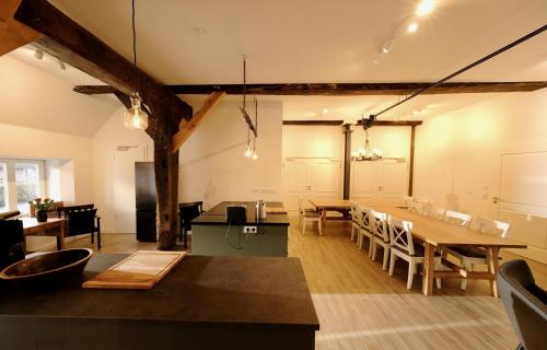 a kitchen and dining room with a table and chairs at Hausdeich in Hamburg