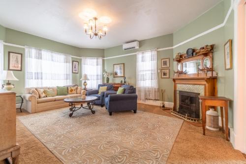 a living room with a couch and a fireplace at Rustic 2-Bedroom walking distance to Downtown in Reno