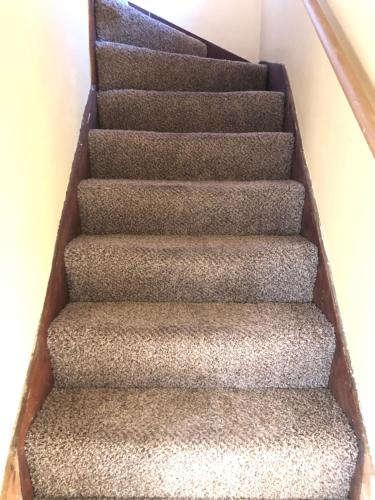 a set of stairs in a house at The Lodge Dog and Family Friendly 5 Bedrooms 13 guests 10 beds in Saint Peter