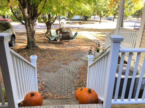 two pumpkins sitting on the steps of a house at The Lodge Dog and Family Friendly 5 Bedrooms 13 guests 10 beds in Saint Peter