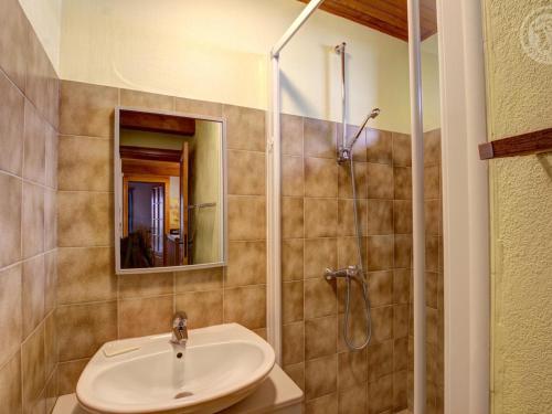 a bathroom with a sink and a shower at Gîte Saint-Bonnet-le-Courreau, 5 pièces, 6 personnes - FR-1-496-9 in Saint-Bonnet-le-Courreau