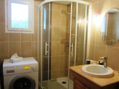 a bathroom with a shower and a sink and a washing machine at Appartement Villard-de-Lans, 3 pièces, 6 personnes - FR-1-689-4 in Villard-de-Lans
