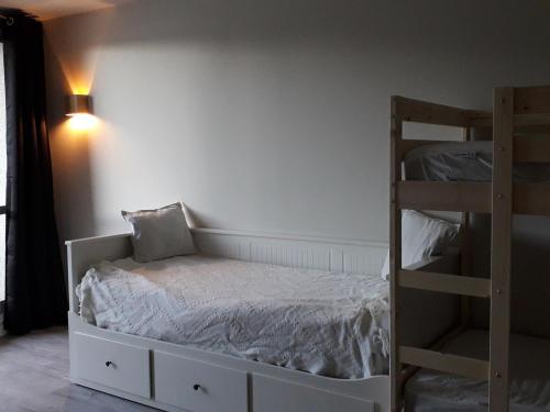a bedroom with a bed and a bunk bed at Appartement Villard-de-Lans, 3 pièces, 8 personnes - FR-1-689-8 in Villard-de-Lans