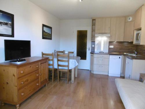 a living room with a kitchen and a dining room at Studio Corrençon-en-Vercors, 1 pièce, 5 personnes - FR-1-689-62 in Corrençon-en-Vercors