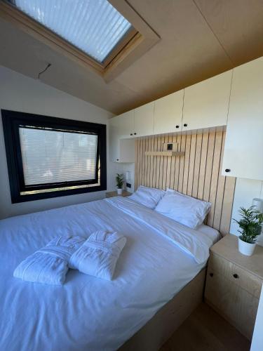 Postel nebo postele na pokoji v ubytování Peaceful Tinies