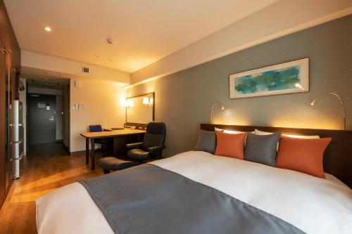 מיטה או מיטות בחדר ב-Hotel New Port Yokosuka