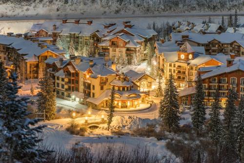 a resort in the winter with snow covered buildings at 2304- Two Bedroom Deluxe Eagle Springs East Hotel Room in Solitude