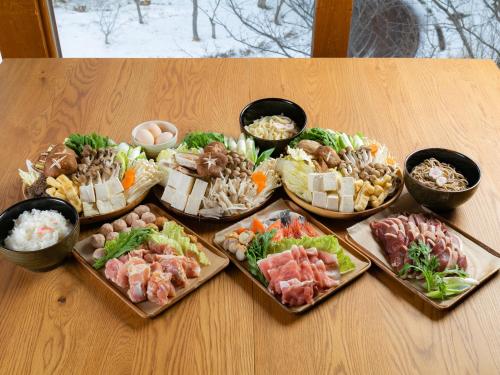 a table with a bunch of different types of food at Matsue Forest Park in Matsue