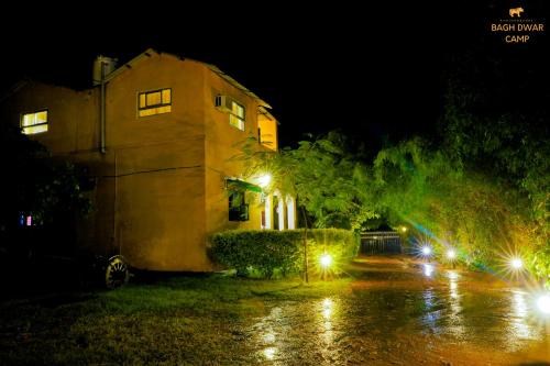 a house at night with lights in front of it at Ranthambhore Bagh Dwar Camp in Khilchipur