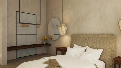Postel nebo postele na pokoji v ubytování Areos Polis Boutique Hotel