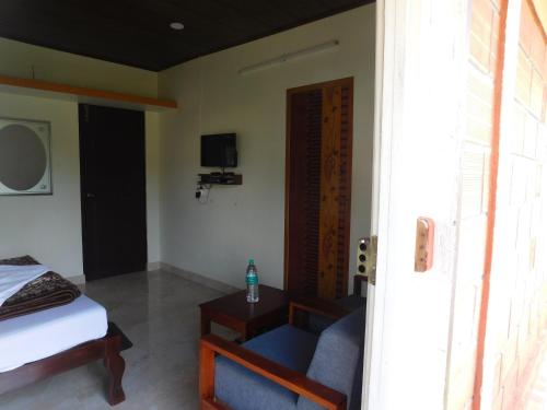 Cauvery Homestayにあるテレビまたはエンターテインメントセンター