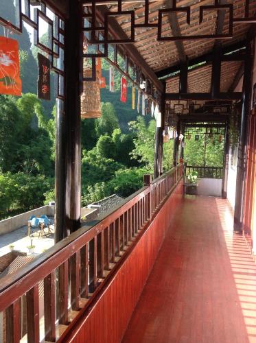 a bridge in a building with a view of a mountain at Xingping Our Inn in Yangshuo