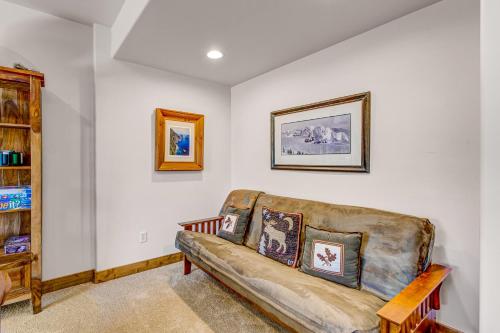 a living room with a couch and paintings on the wall at Cedar Haven in Park City
