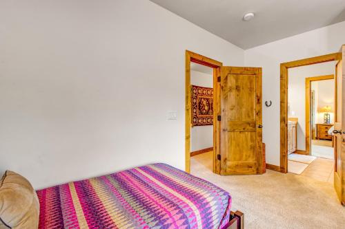 a bedroom with a bed and a wooden door at Cedar Haven in Park City