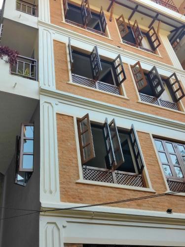 a building with windows on the side of it at Karuna Hotel Patan Kathmandu in Pātan
