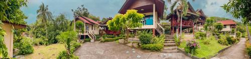 an image of a house with a garden at Tanouy Garden in Baan Khai