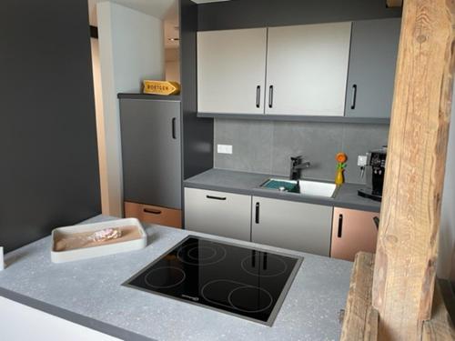 a kitchen with a sink and a counter top at Zimmermanns 2 in Monschau