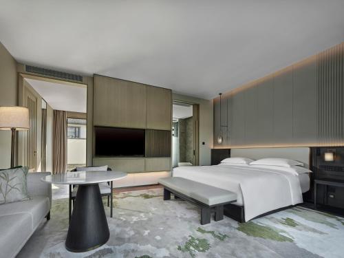 Ein Bett oder Betten in einem Zimmer der Unterkunft HOMM Huzhou Xisai Shan