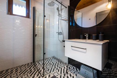 a bathroom with a sink and a shower at TATRYSTAY Family Villa Rosa in Stará Lesná